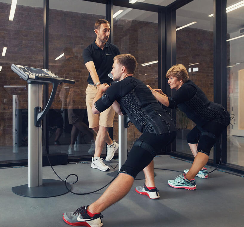 EMS Personal Training in Canterbruy 2 people doing EMS personal training session in Canterbury.